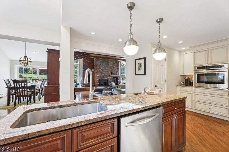 Dining room, Interior, Kitchen, Pendant Lights, Recessed Lighting, Stainless Steel Appliances, Stone Walls, Wood Texture Flooring
