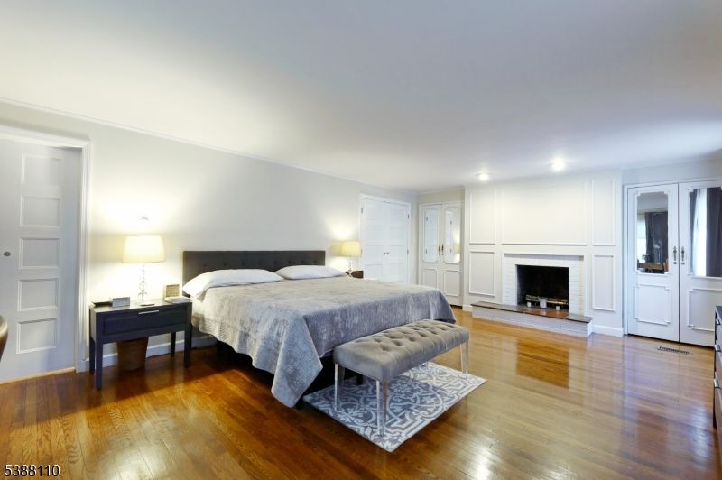 Bedroom, Fireplace, Interior, Recessed Lighting, Wood Texture Flooring