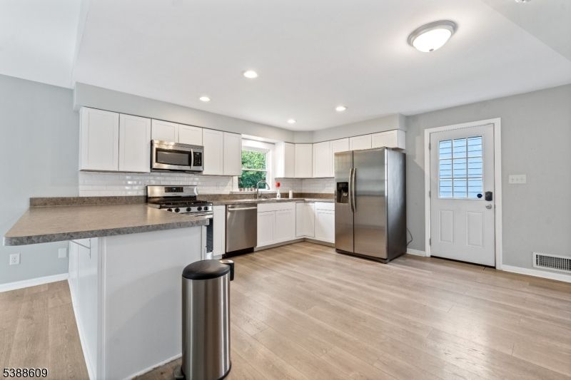 Interior, Kitchen, Recessed Lighting, Stainless Steel Appliances, Wood Texture Flooring