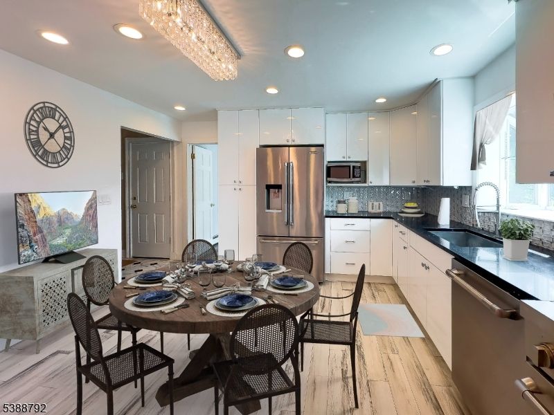 Chandelier, Dining room, Interior, Kitchen, Recessed Lighting, Stainless Steel Appliances, Wood Texture Flooring