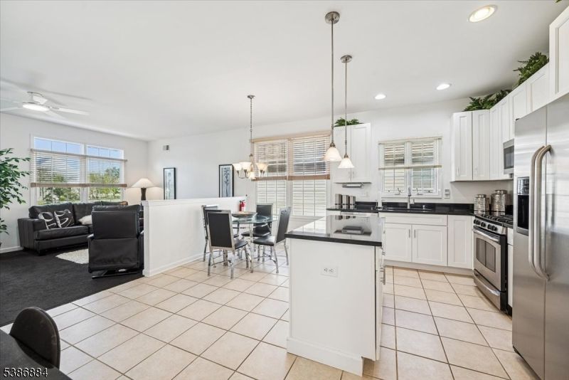 Chandelier, Dining room, Interior, Kitchen, Living room, Pendant Lights, Recessed Lighting, Stainless Steel Appliances