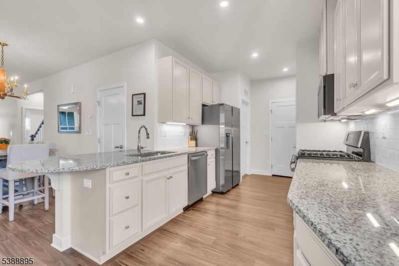 Chandelier, Interior, Kitchen, Recessed Lighting, Stainless Steel Appliances, Wood Texture Flooring