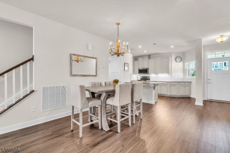 Chandelier, Dining room, Interior, Kitchen, Recessed Lighting, Stainless Steel Appliances, Wood Texture Flooring