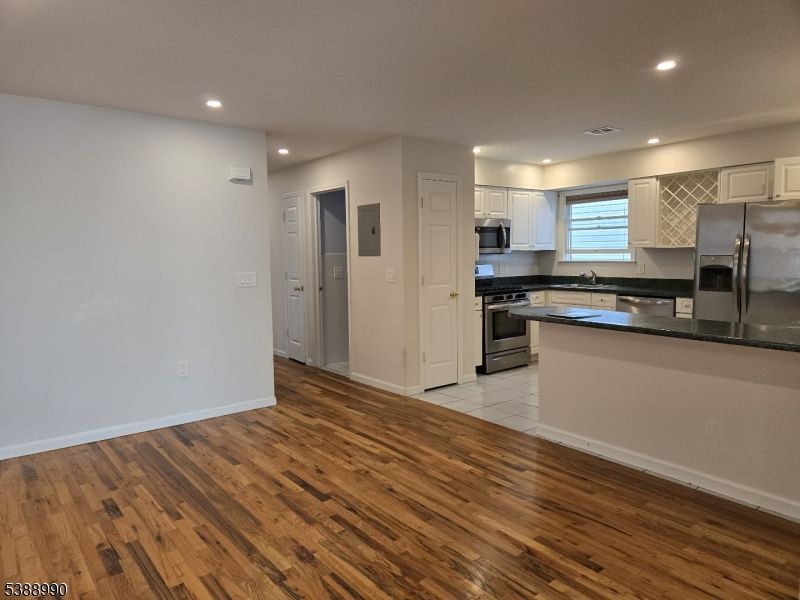 Interior, Kitchen, Recessed Lighting, Stainless Steel Appliances, Wood Texture Flooring