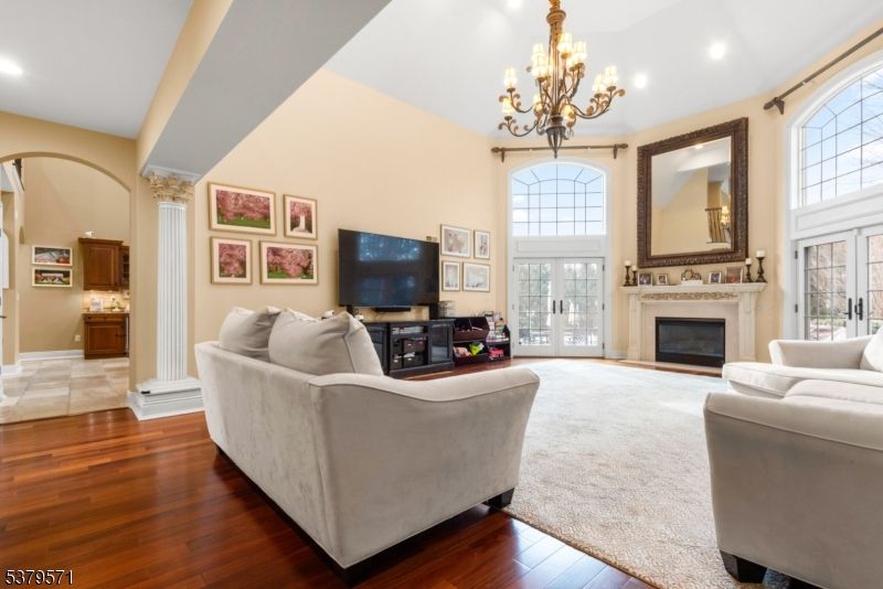 Chandelier, Fireplace, Interior, Living room, Recessed Lighting, Wood Texture Flooring