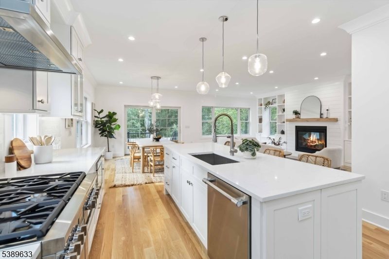 Dining room, Fireplace, Interior, Kitchen, Living room, Pendant Lights, Recessed Lighting, Stainless Steel Appliances, Wood Texture Flooring