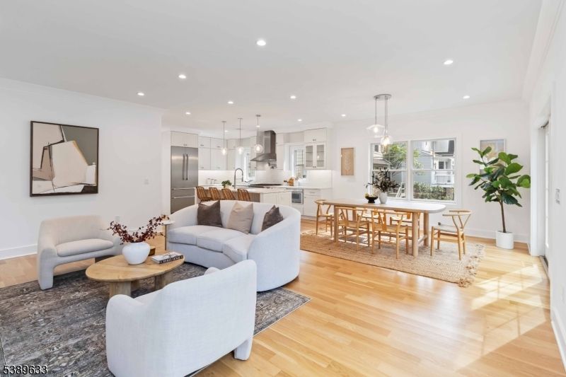 Dining room, Interior, Kitchen, Living room, Pendant Lights, Recessed Lighting, Stainless Steel Appliances, Wood Texture Flooring