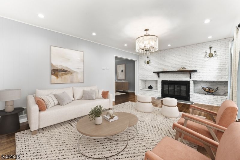 Chandelier, Fireplace, Interior, Living room, Recessed Lighting, Stone Walls, Wood Texture Flooring