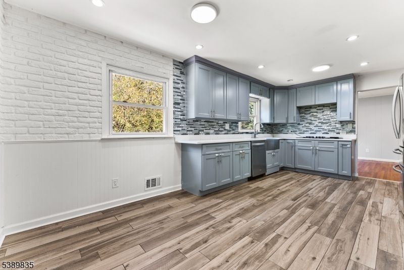 Interior, Kitchen, Recessed Lighting, Stainless Steel Appliances, Stone Walls, Wood Texture Flooring