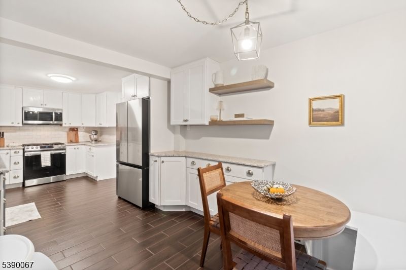 Dining room, Interior, Kitchen, Pendant Lights, Stainless Steel Appliances, Wood Texture Flooring