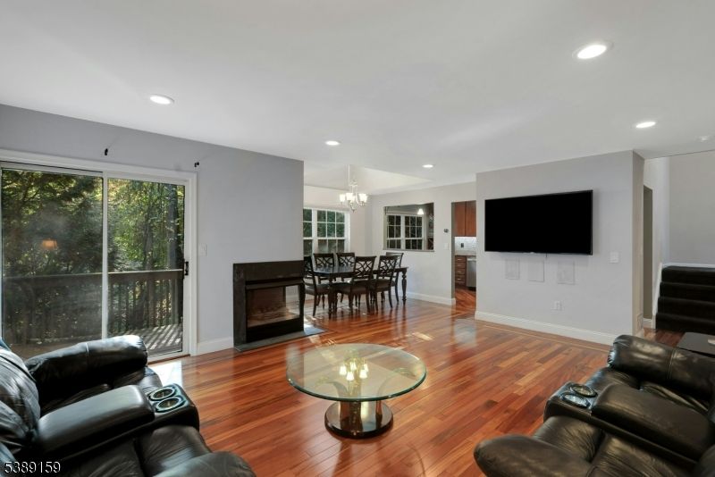 Chandelier, Dining room, Fireplace, Interior, Living room, Recessed Lighting, Wood Texture Flooring