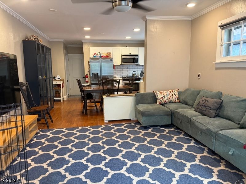 Dining room, Interior, Kitchen, Living room, Recessed Lighting, Stainless Steel Appliances, Wood Texture Flooring