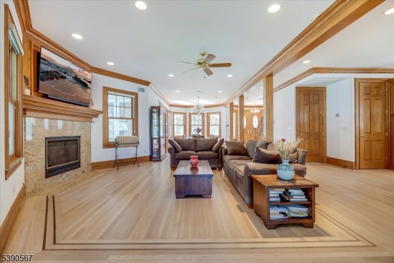 Chandelier, Fireplace, Interior, Living room, Recessed Lighting, Wood Texture Flooring