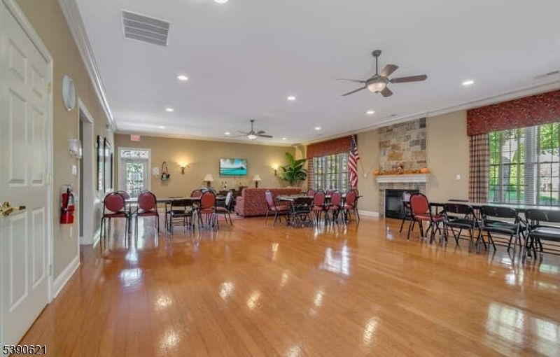 Dining room, Fireplace, Interior, Recessed Lighting, Stone Walls, Wood Texture Flooring