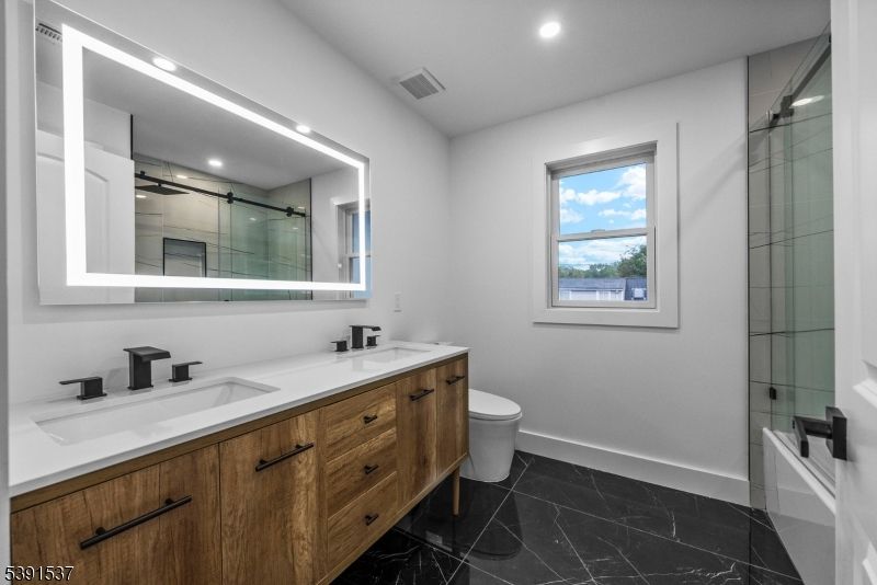 Bathroom, Dual Sink Vanities, Glass Shower, Interior, Marble, Recessed Lighting