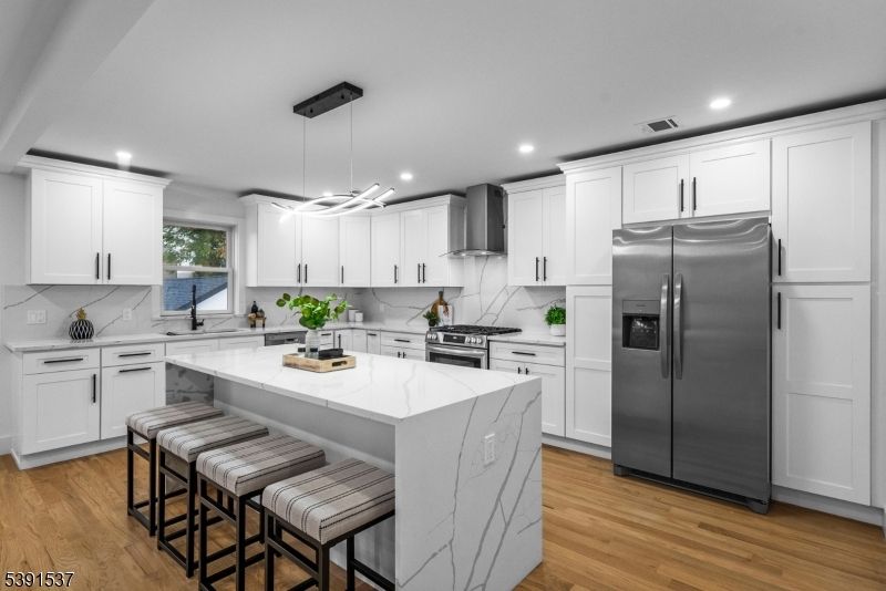 Interior, Kitchen, Marble Walls, Pendant Lights, Recessed Lighting, Stainless Steel Appliances, Wood Texture Flooring