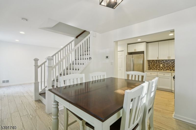 Dining room, Interior, Kitchen, Recessed Lighting, Stainless Steel Appliances, Wood Texture Flooring