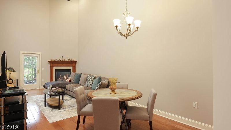 Chandelier, Dining room, Fireplace, Interior, Living room, Wood Texture Flooring