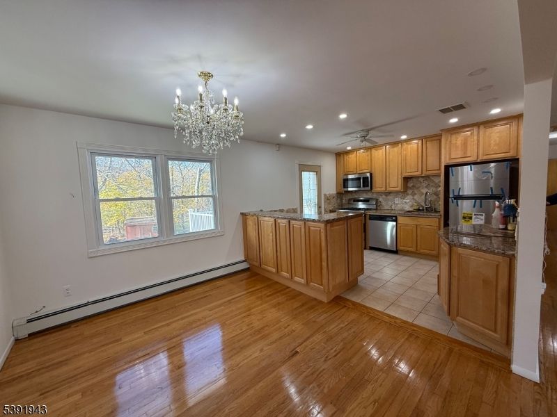 Chandelier, Interior, Kitchen, Recessed Lighting, Stainless Steel Appliances, Wood Texture Flooring