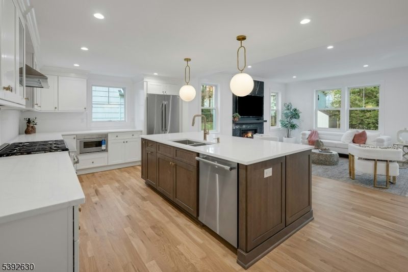 Fireplace, Interior, Kitchen, Living room, Pendant Lights, Recessed Lighting, Stainless Steel Appliances, Wood Texture Flooring