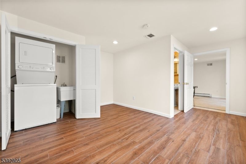 Empty room, Interior, Recessed Lighting, Utility Closets, Washer, Wood Texture Flooring