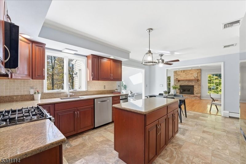 Fireplace, Interior, Kitchen, Living room, Pendant Lights, Stainless Steel Appliances, Stone Walls