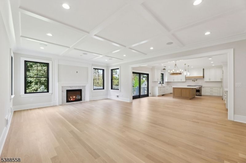 Empty room, Fireplace, Interior, Kitchen, Pendant Lights, Recessed Lighting, Wood Texture Flooring
