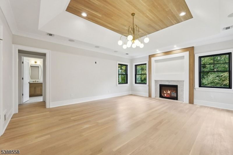 Empty room, Fireplace, Interior, Pendant Lights, Recessed Lighting, Wooden Ceilings, Wood Texture Flooring