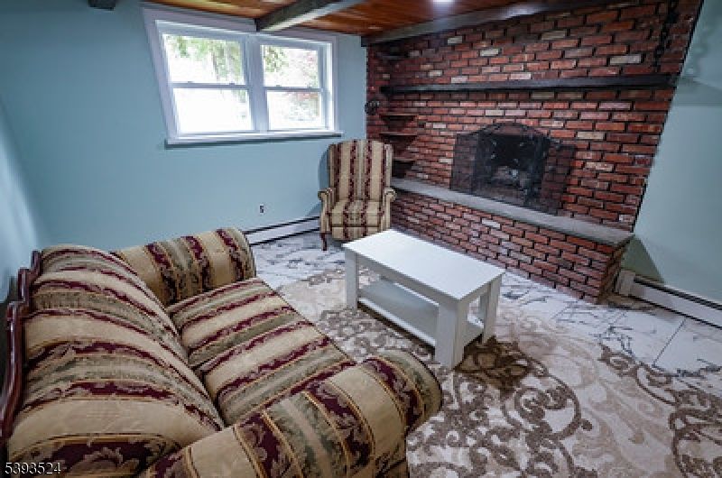 Fireplace, Interior, Living room, Recessed Lighting, Stone Walls, Wooden Ceilings