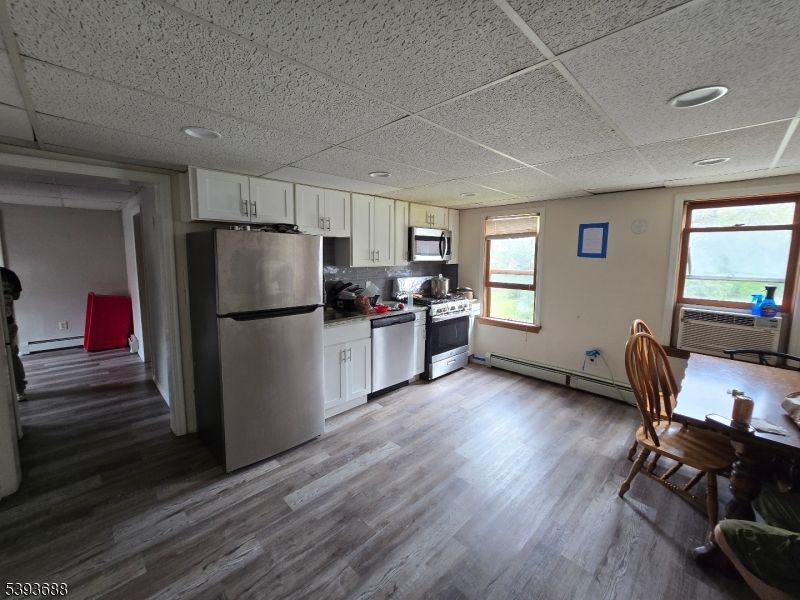 Dining room, Interior, Kitchen, Recessed Lighting, Stainless Steel Appliances, Wood Texture Flooring