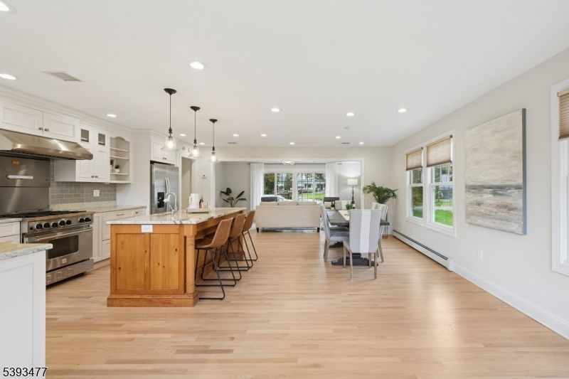 Dining room, Interior, Kitchen, Pendant Lights, Recessed Lighting, Stainless Steel Appliances, Wood Texture Flooring
