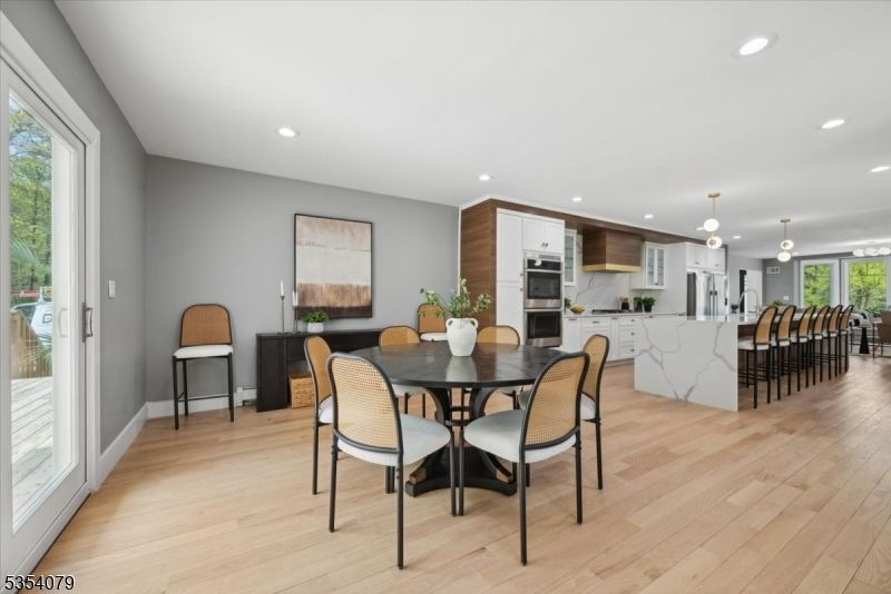 Dining room, Interior, Kitchen, Pendant Lights, Recessed Lighting, Stainless Steel Appliances, Wood Texture Flooring