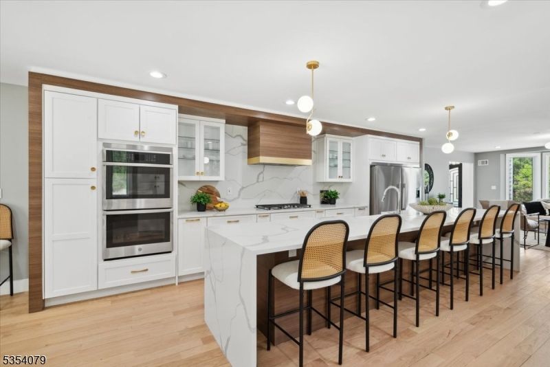 Interior, Kitchen, Marble Walls, Pendant Lights, Recessed Lighting, Stainless Steel Appliances, Wood Texture Flooring