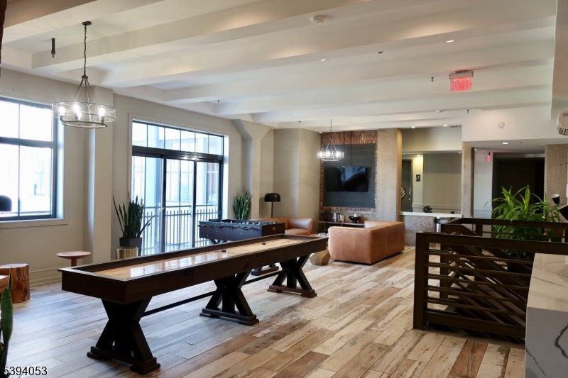 Billiard Table, Chandelier, Game Room, Interior, Living room, Pendant Lights, Recessed Lighting, Wood Texture Flooring
