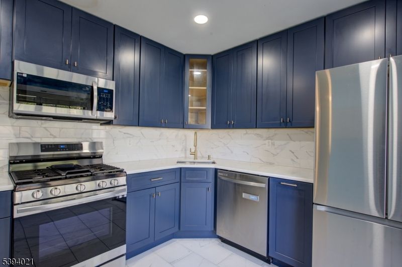 Interior, Kitchen, Marble, Marble Walls, Recessed Lighting, Stainless Steel Appliances