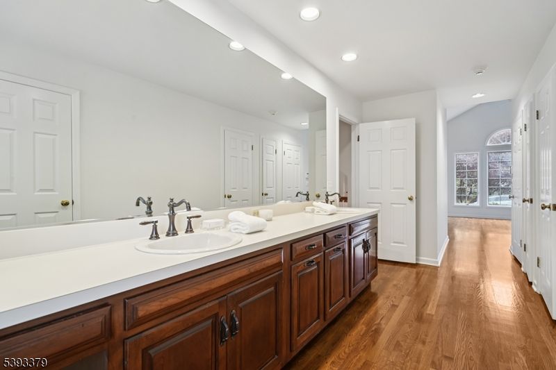 Bathroom, Dual Sink Vanities, Interior, Recessed Lighting, Wood Texture Flooring