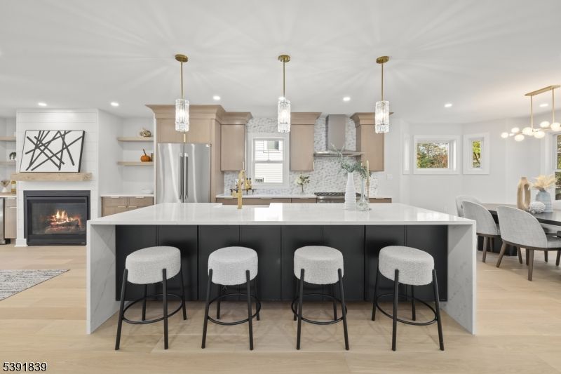 Dining room, Fireplace, Interior, Kitchen, Pendant Lights, Recessed Lighting, Stainless Steel Appliances, Wood Texture Flooring