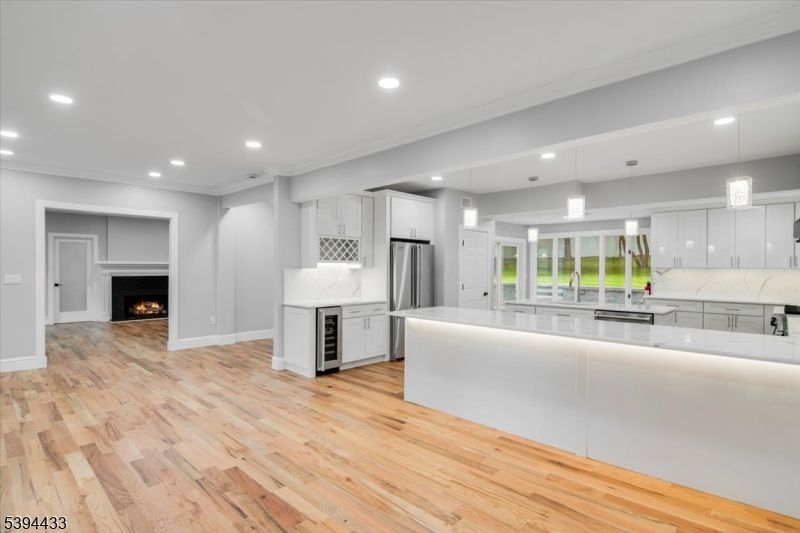 Fireplace, Interior, Kitchen, Pendant Lights, Recessed Lighting, Stainless Steel Appliances, Wood Texture Flooring