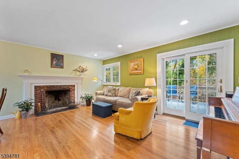 Fireplace, Interior, Living room, Piano, Recessed Lighting, Wood Texture Flooring