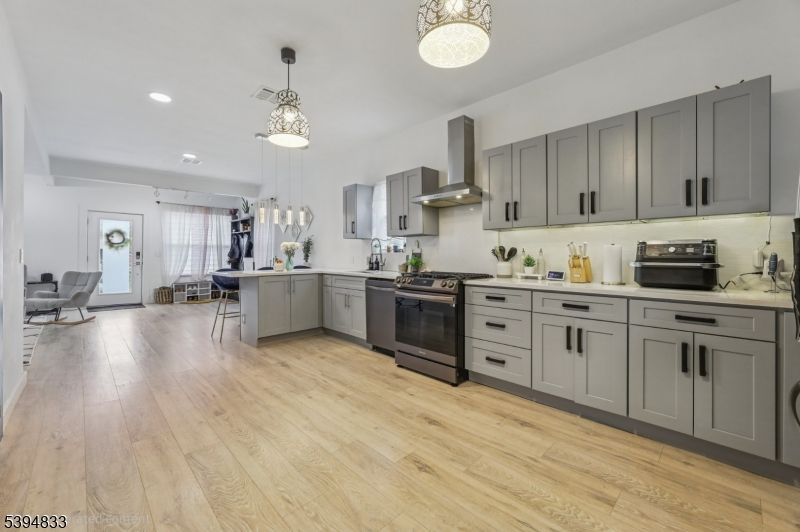 Dining room, Interior, Kitchen, Pendant Lights, Recessed Lighting, Stainless Steel Appliances, Wood Texture Flooring