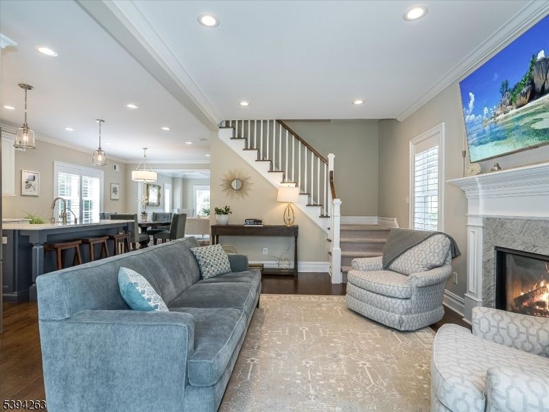 Dining room, Fireplace, Interior, Living room, Pendant Lights, Recessed Lighting, Wood Texture Flooring