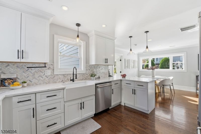 Dining room, Interior, Kitchen, Pendant Lights, Recessed Lighting, Stainless Steel Appliances, Wood Texture Flooring