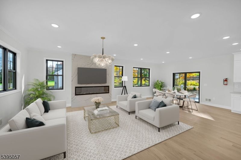 Dining room, Fireplace, Interior, Living room, Marble Walls, Pendant Lights, Recessed Lighting, Wood Texture Flooring