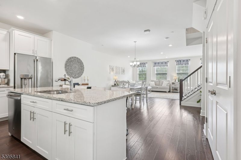 Chandelier, Dining room, Interior, Kitchen, Living room, Recessed Lighting, Stainless Steel Appliances, Wood Texture Flooring