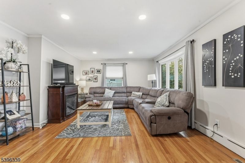 Fireplace, Interior, Living room, Recessed Lighting, Wood Texture Flooring