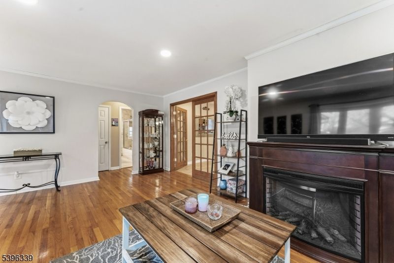 Fireplace, Interior, Piano, Recessed Lighting, Wood Texture Flooring