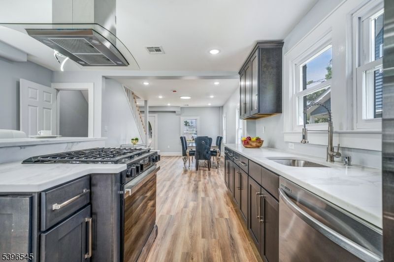 Dining room, Interior, Kitchen, Recessed Lighting, Stainless Steel Appliances, Wood Texture Flooring
