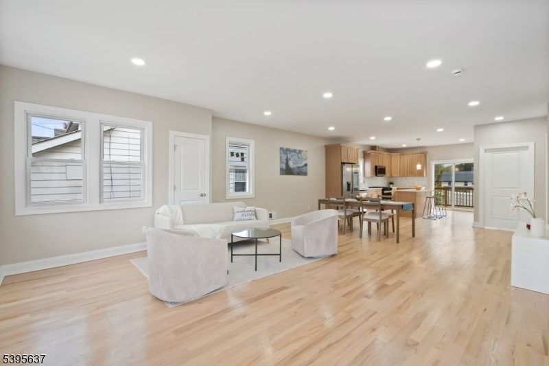 Dining room, Interior, Kitchen, Living room, Recessed Lighting, Stainless Steel Appliances, Wood Texture Flooring