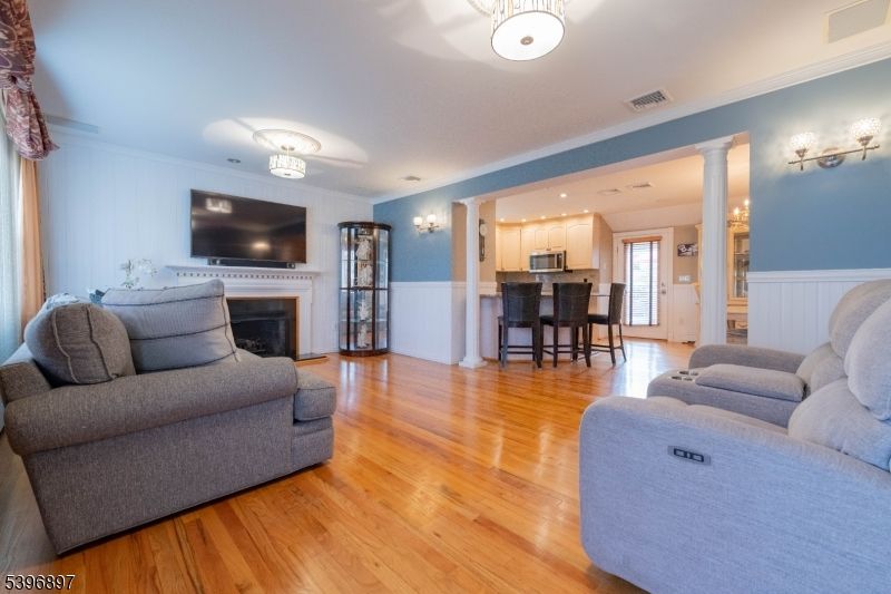 Dining room, Fireplace, Interior, Kitchen, Living room, Recessed Lighting, Wood Texture Flooring