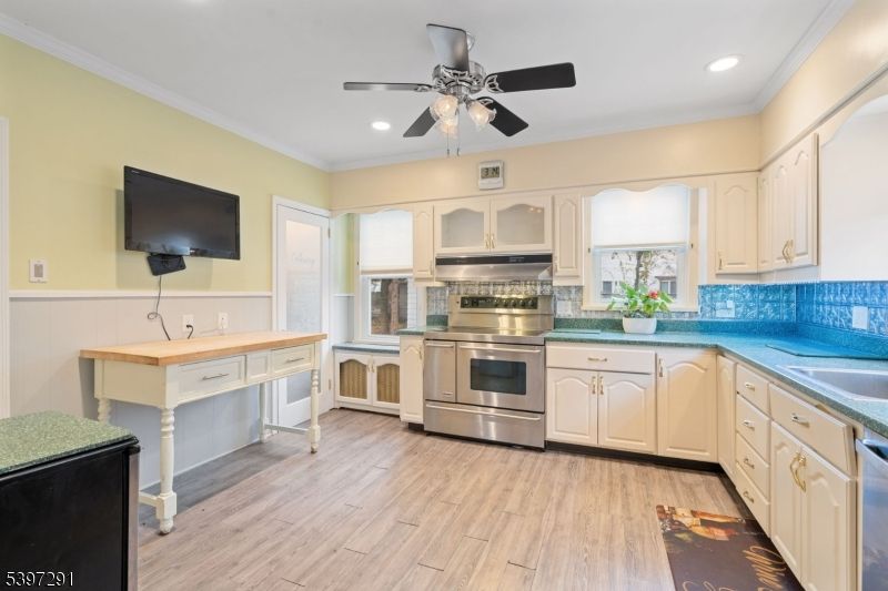 Interior, Kitchen, Recessed Lighting, Stainless Steel Appliances, Tile Countertops, Wood Texture Flooring